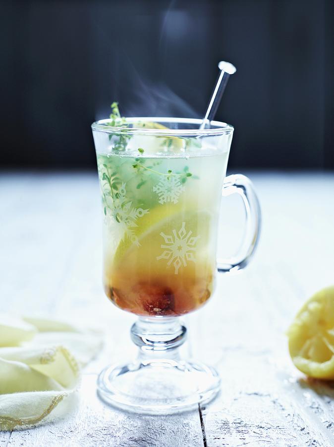 Hot Lemon With Ginger And Lemon Thyme Photograph by Oliver Brachat