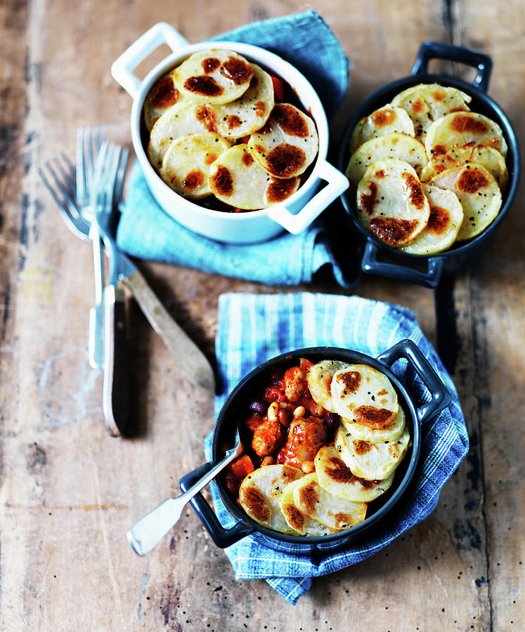 Hotpots With Beans, Sausage And Potatoes Photograph by Karen Thomas ...