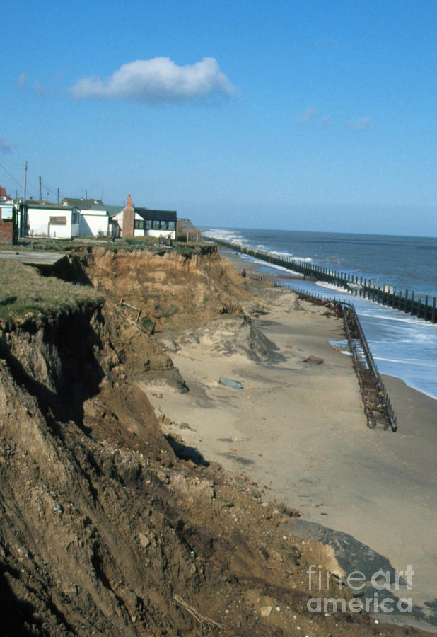 Houses At The Edge Of A Sea Eroded Cliff Photograph by Graeme Ewens/science Photo Library