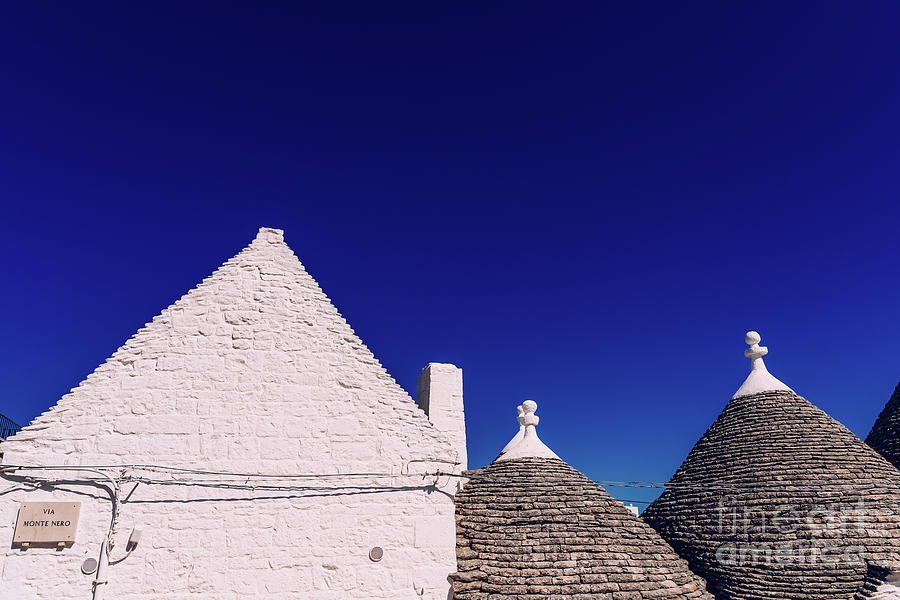 Houses of the tourist and famous Italian city of Alberobello, wi Photograph by Joaquin Corbalan
