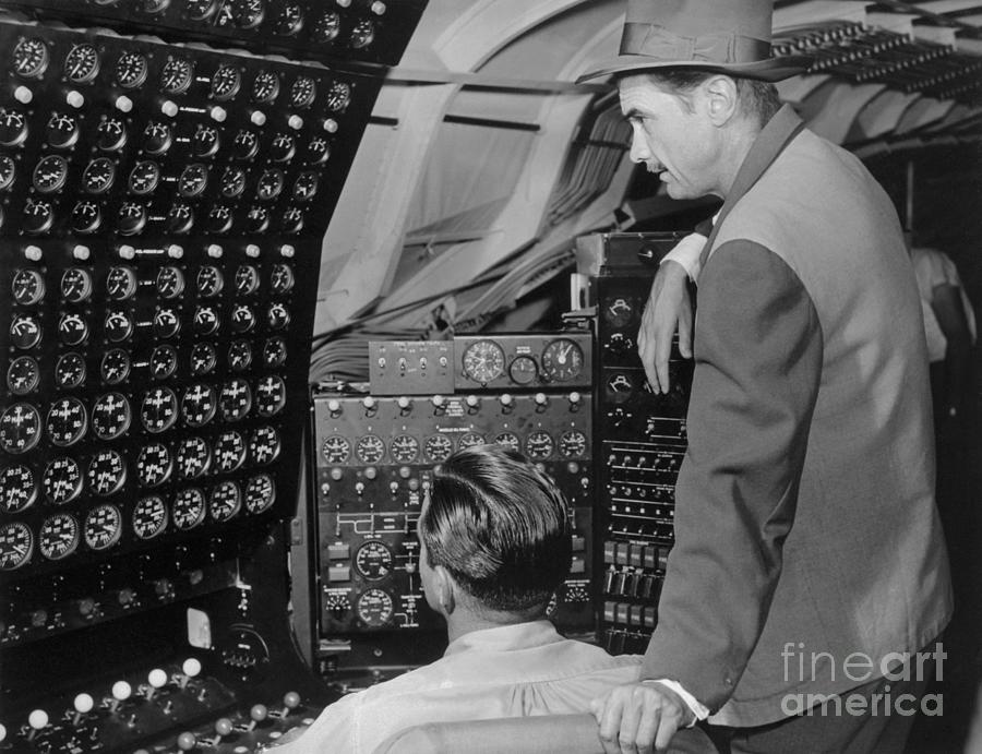 Howard Hughes Checking Dials Photograph by Bettmann