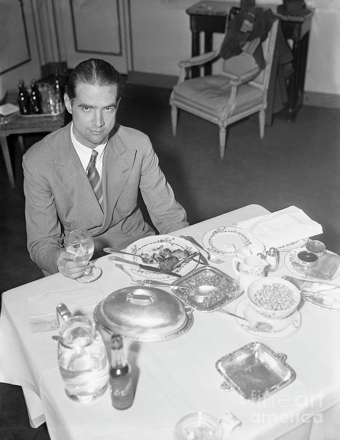Howard Hughes Eating Breakfast Photograph by Bettmann