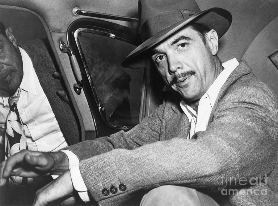 Howard Hughes Seated In Car Photograph by Bettmann