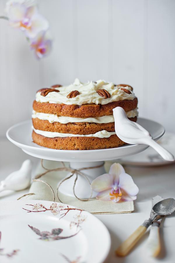 Hummingbird Cake On A Cake Stand With A Napkin, An Orchid Flowers, A Ceramic Birds Decorations, Plates And Cutlery. Photograph by Magdalena Hendey