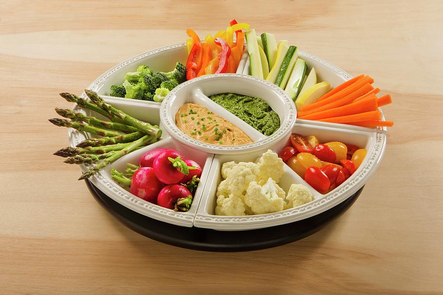 Hummus And Pesto Dip With Raw Vegetables In Bowls Photograph by Colin Cooke