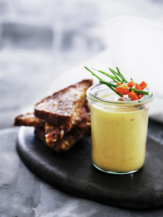 Hummus In A Glass With Toasted Bread Photograph by Mikkel Adsbl