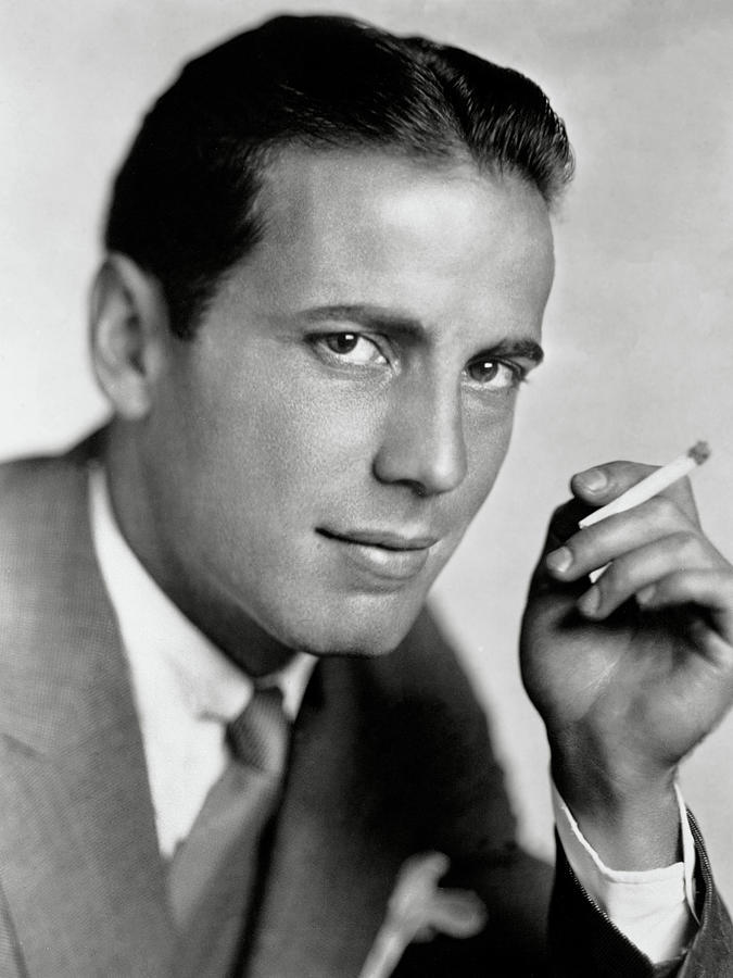Hollywood Photograph - Humphrey Bogart Smoking by Globe Photos