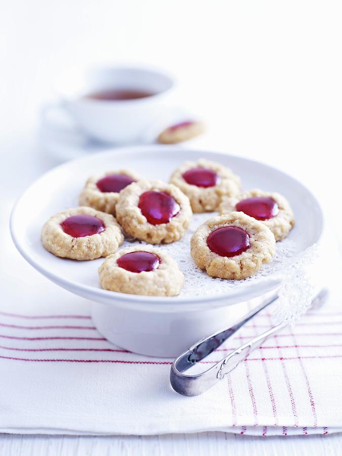 Husarenbusserl shortbread Jam Biscuits On A Cake Stand Photograph by Oliver Brachat