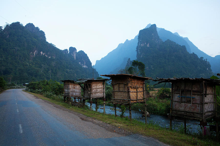 Huts On Rural Road, Vang Vieng, Vang Photograph by Pixelchrome Inc