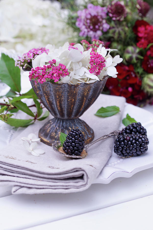Hydrangea Blossom And Red Yarrow In A Silver Sundae Photograph by Angelica Linnhoff