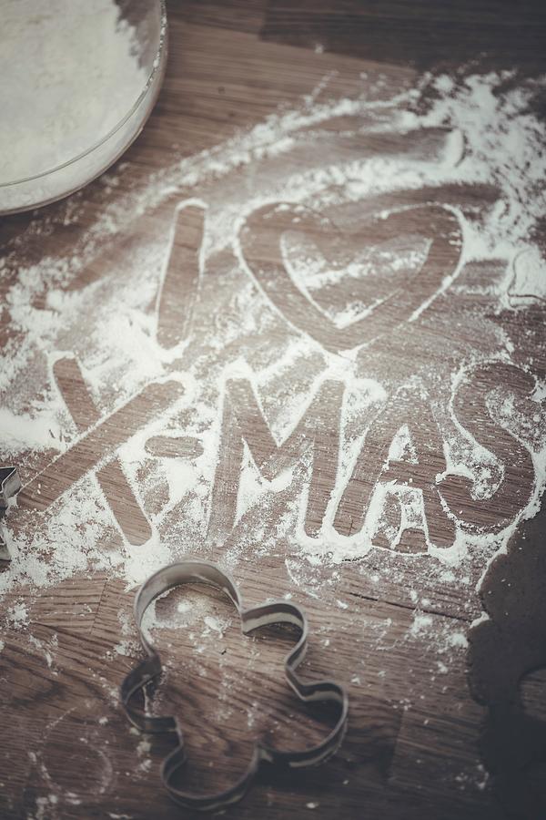 i Love Xmas Written In Flour On A Wooden Board Photograph by Eising Studio