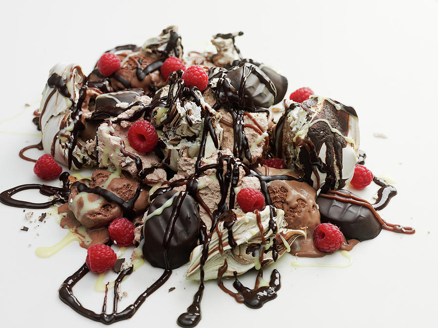 Ice Cream Piled With Confectionery, Chocolate Sauce And Raspberries Photograph by Pepe Nilsson