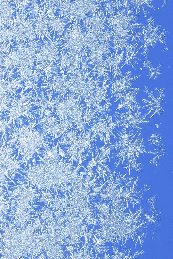 Ice Crystals Against Blue Background Photograph by Petr Gross