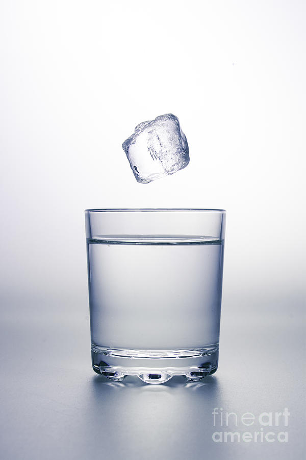 Ice Cube Falling Into Glass Of Water Photograph by Leonello Calvetti/science Photo Library
