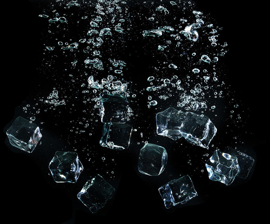 Ice Cubes Splashing In Water Photograph by Buena Vista Images
