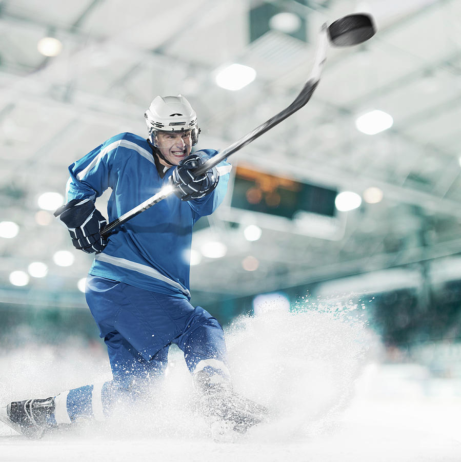 Ice Hockey Player Shooting Puck Photograph by Bernhard Lang