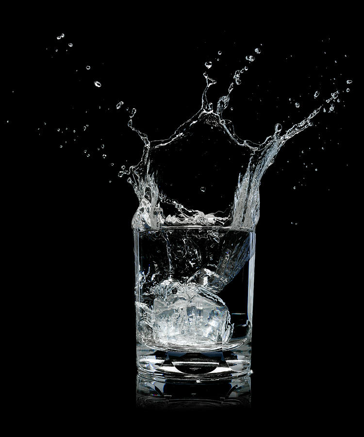 Ice Splashing Into Water Glass Photograph by Chris Stein Ice Splashing Into Water Glass Photograph by Chris Stein