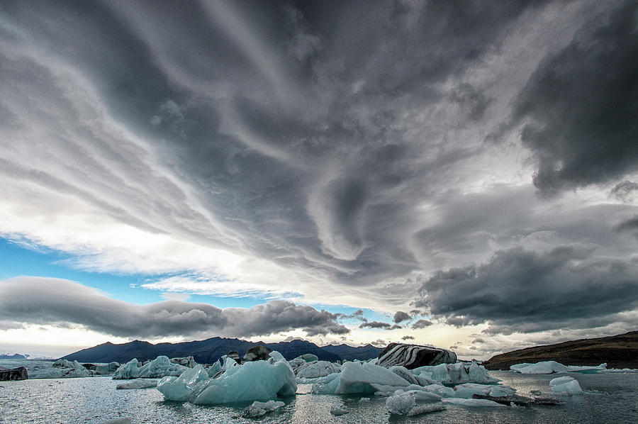 Icebergs In Glacial Lagoon With Stormy Photograph by Mike Hill
