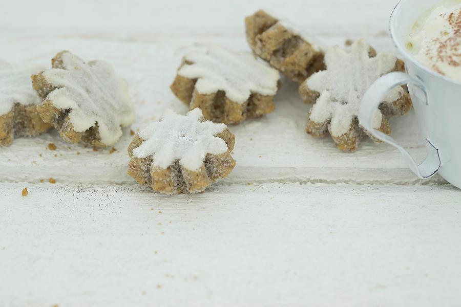Iced Flower-shaped Cinnamon Biscuits Photograph by Martina Schindler