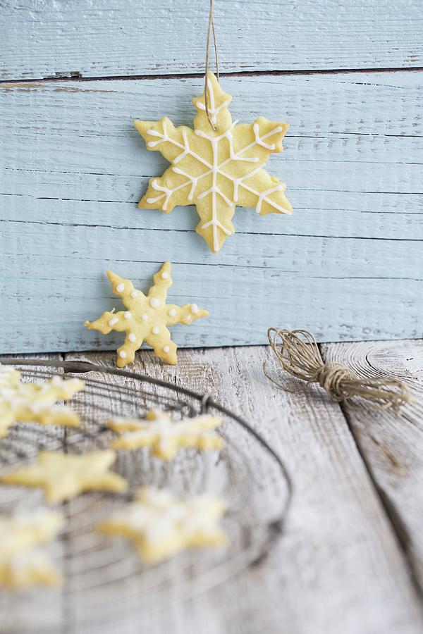 Iced Snowflake Biscuits For Christmas Photograph by Tina Engel