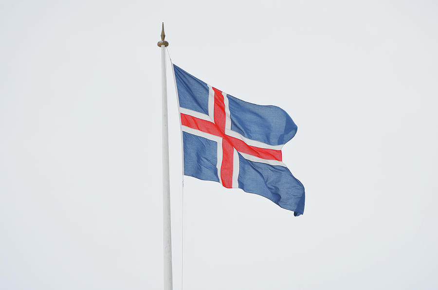 Icelandic Flag Blowing in a Strong Arctic Wind Photograph by Shawn OBrien