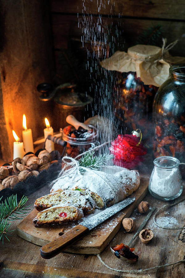 Icing Sugar Being Dusted Over A Christmas Stollen Photograph by Irina Meliukh