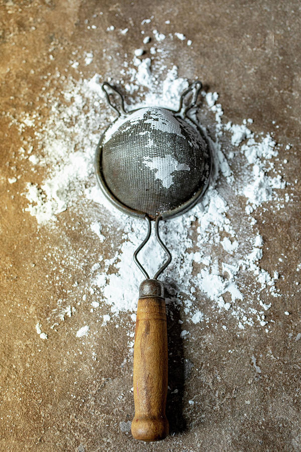 Icing Sugar In An Old Sieve Photograph by Eising Studio