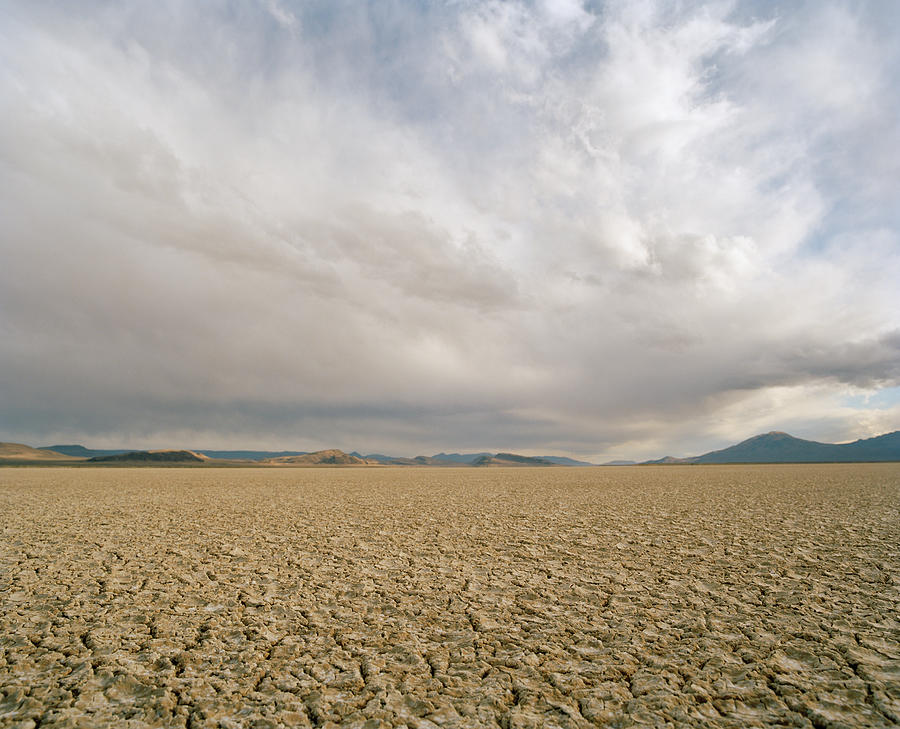 Idaho Desert, Dry Lake Bed With Clouds Photograph by Matthias Clamer