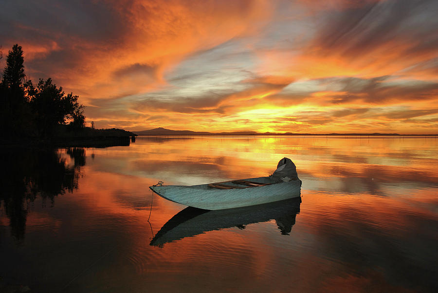 Il barchino al tramonto di Torricella Photograph by Antonella Piselli ...