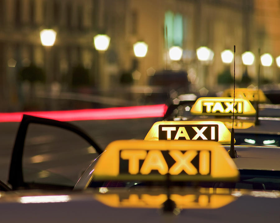 Illuminated Taxi Signs Photograph by Bernhard Lang