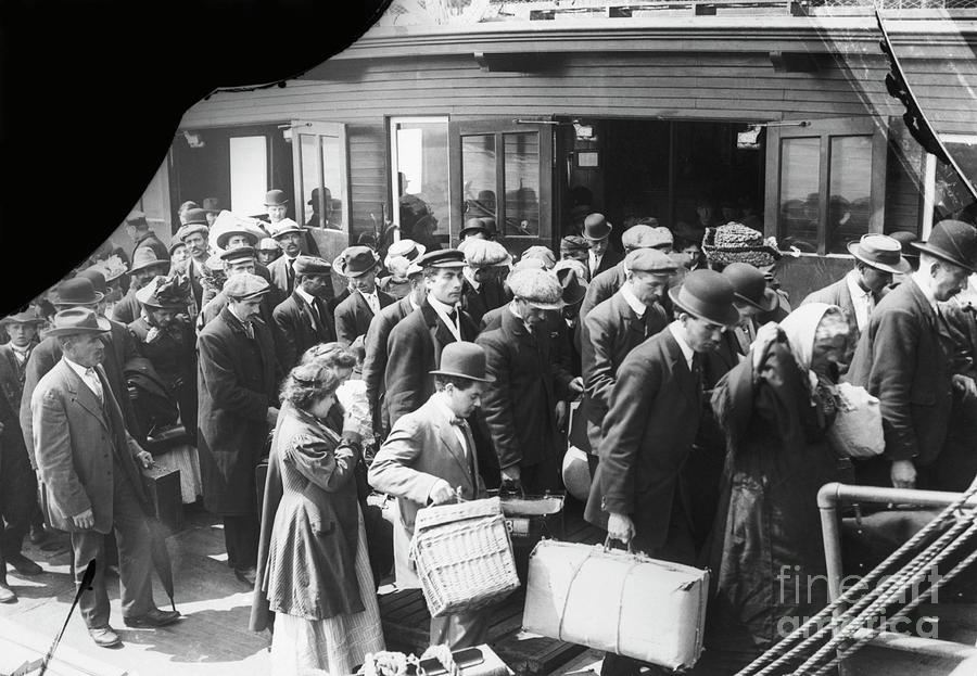 Immigrants Arriving At Ellis Island Photograph by Bettmann