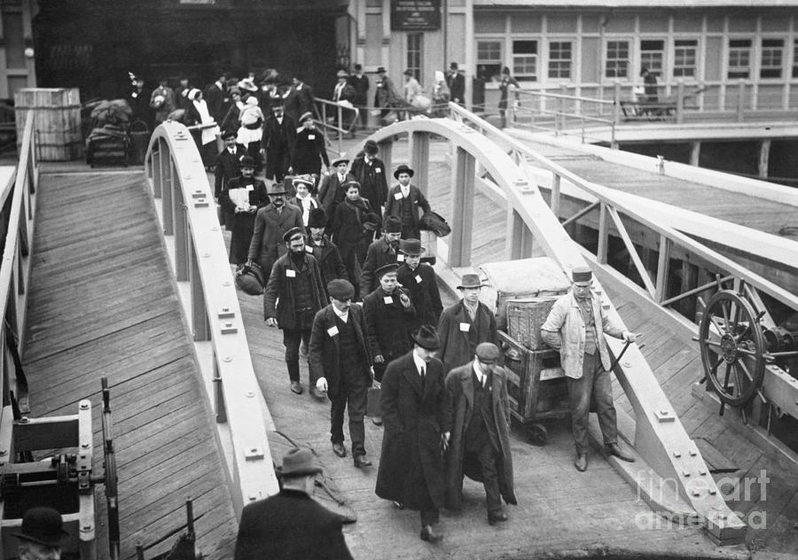Immigrants Leaving Ellis Island Photograph by Bettmann