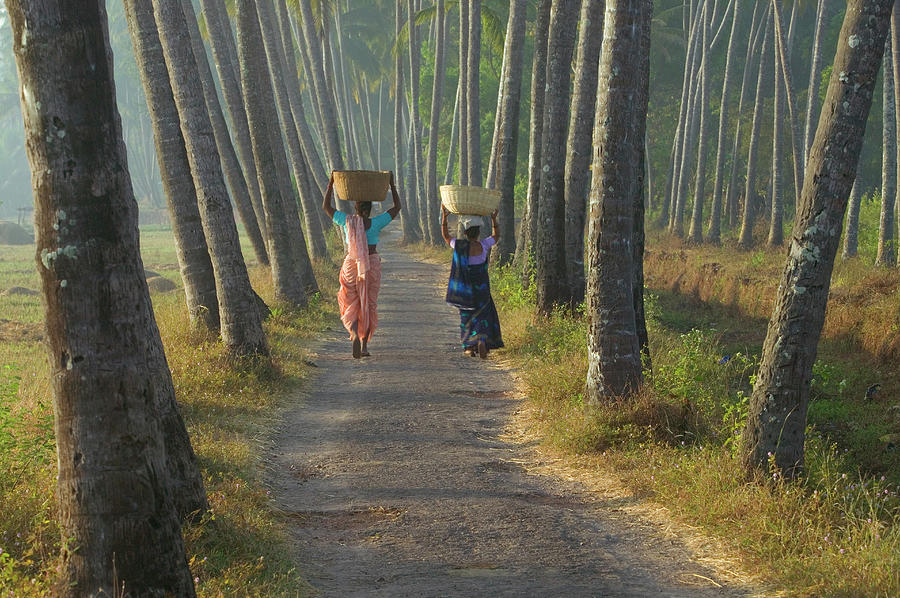 India, Goa, Two Women Walking Along Photograph by Art Wolfe