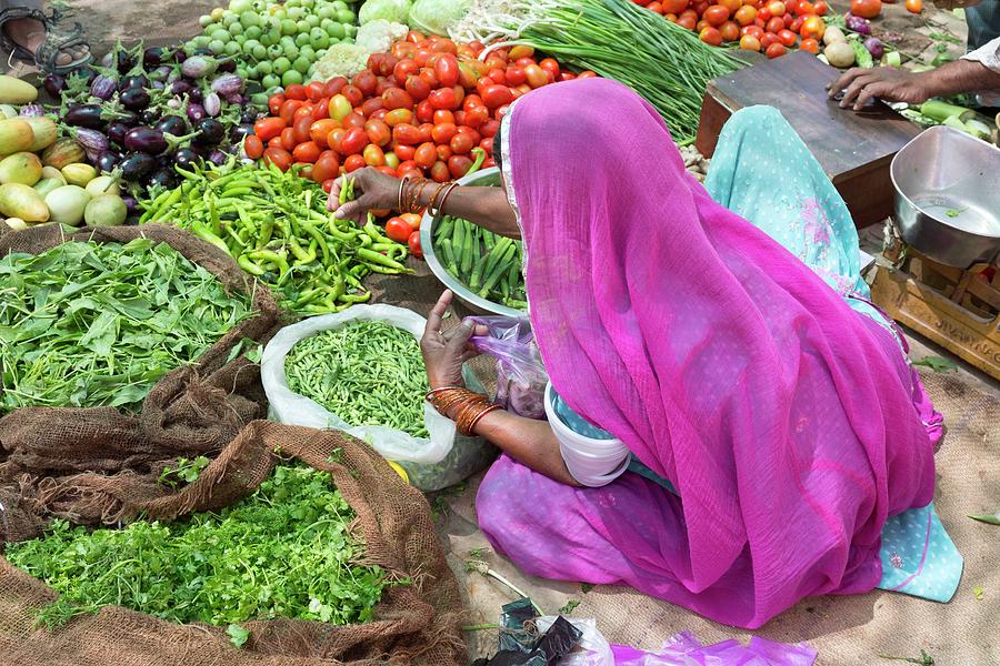 India, Rajasthan, Jaisalmer, A Woman Sells Vegetables At A Market Digital Art by Tim Mannakee