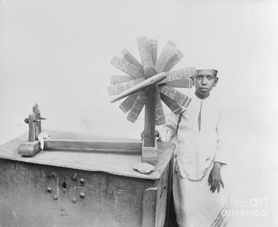 Indian Boy With Weaving Utensil Photograph by Bettmann