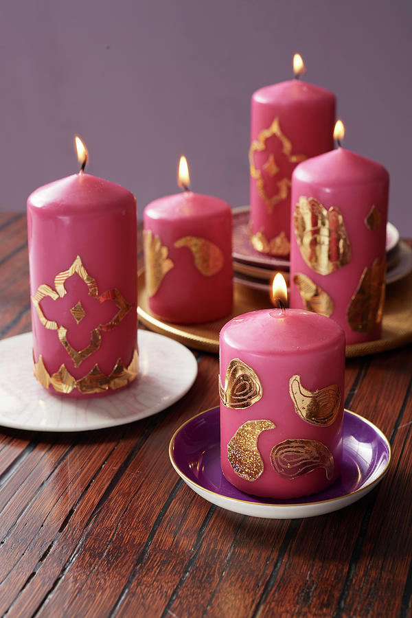 Indian Candle Arrangement: Pink Candles Decorated With Golden Wax Photograph by Jan-peter Stockfood Studios / Westermann