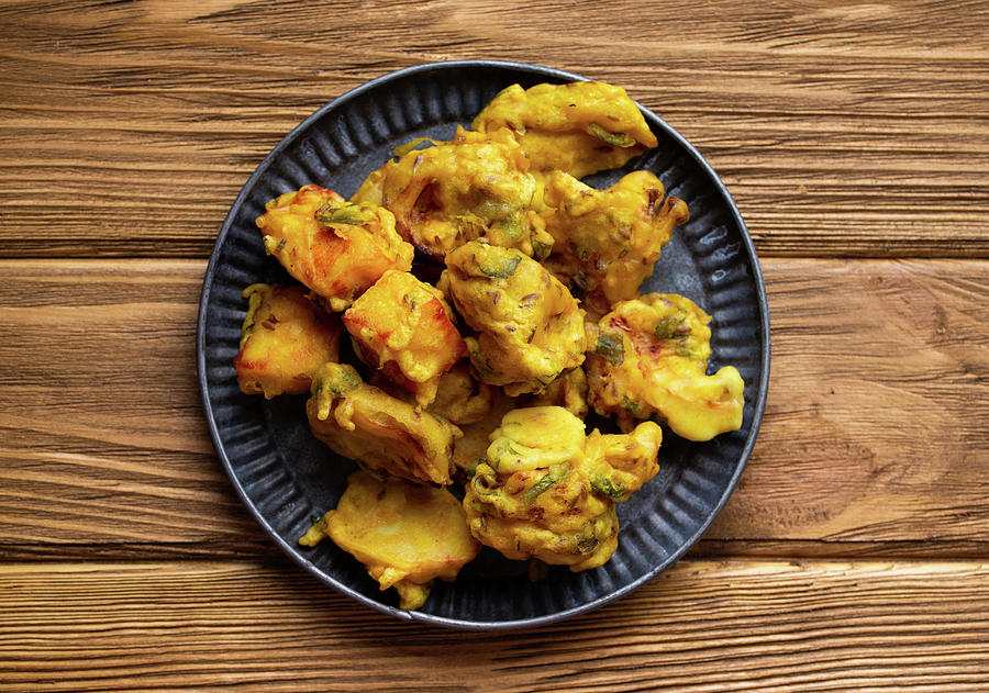 Indian Fried Assorted Pakoras On Wooden Rustic Background Photograph by Olena Yeromenko