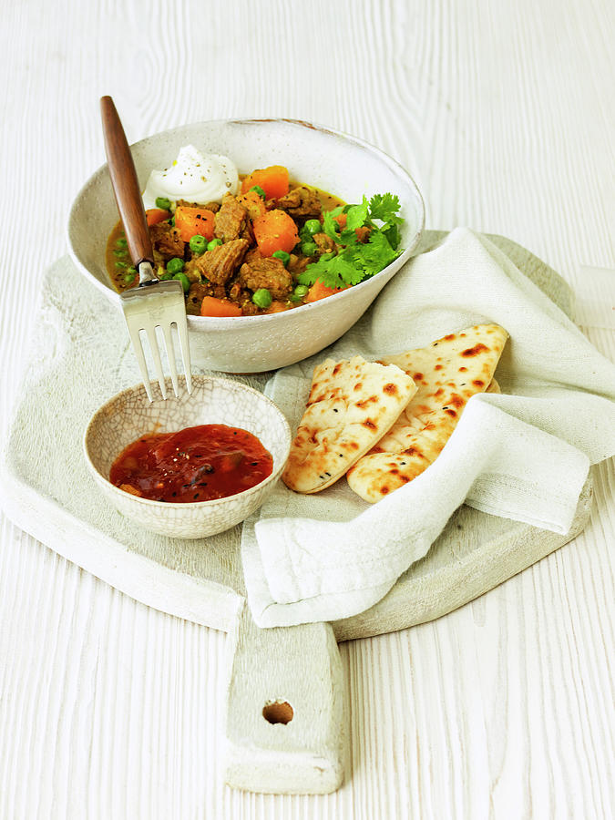 Indian Lamb Curry With Cucumber Raita Butternut Squash Naan Bread And Chutney Photograph by Michael Paul