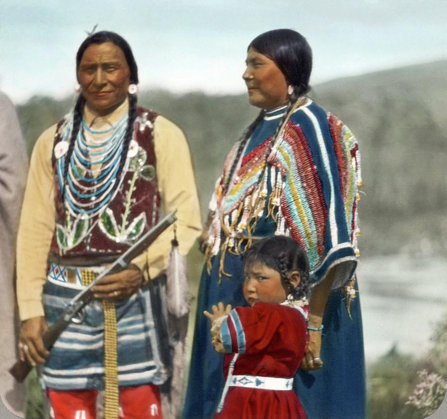 Indian man, woman, and young child in ceremonial dress by Walter McClintock Painting by Celestial Images