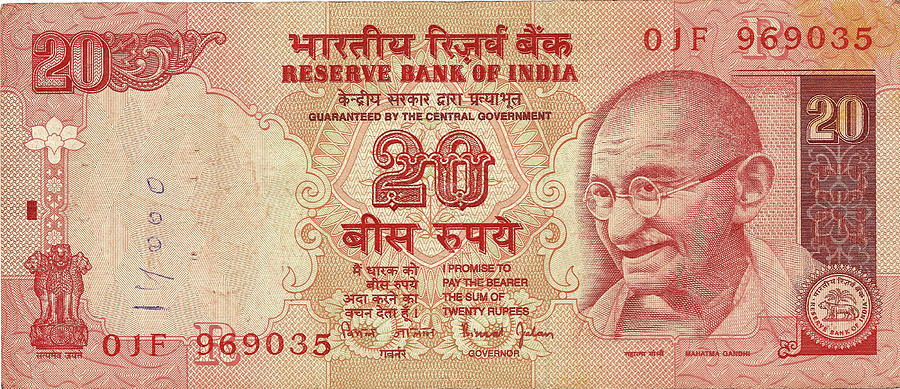 Indian rupee notes with portrait of Gandhi  Photograph by Steve Estvanik