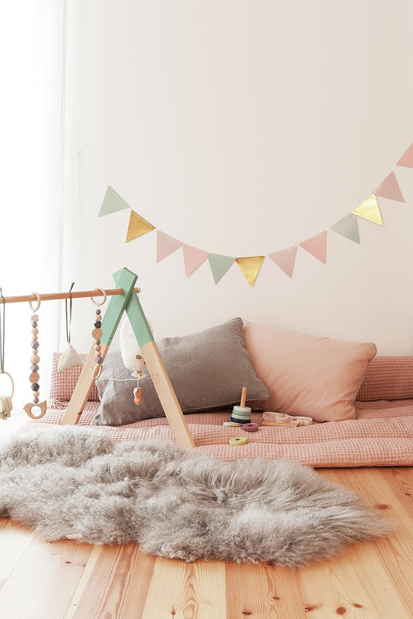 Indoor Play Area With Babys Activity Centre On Fluffy Fur Rug And Bunting Photograph by Hej.hem Interior