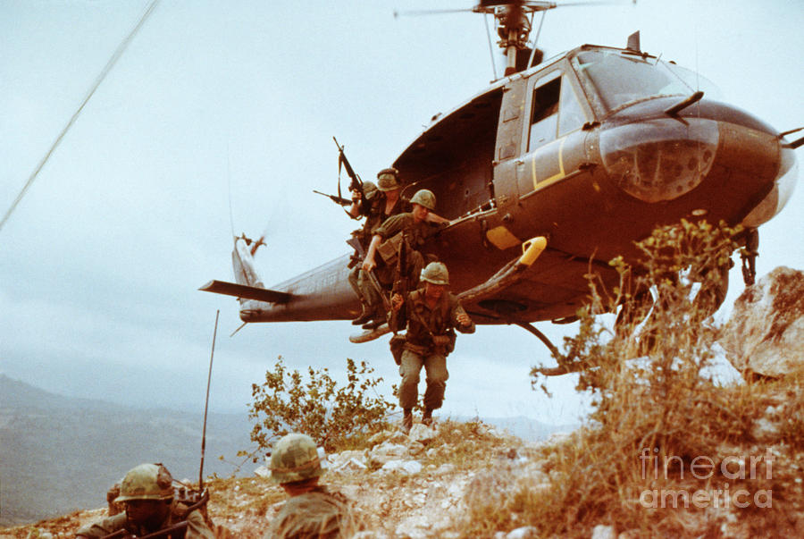 Infantrymen Leaving Helicopter Photograph by Bettmann