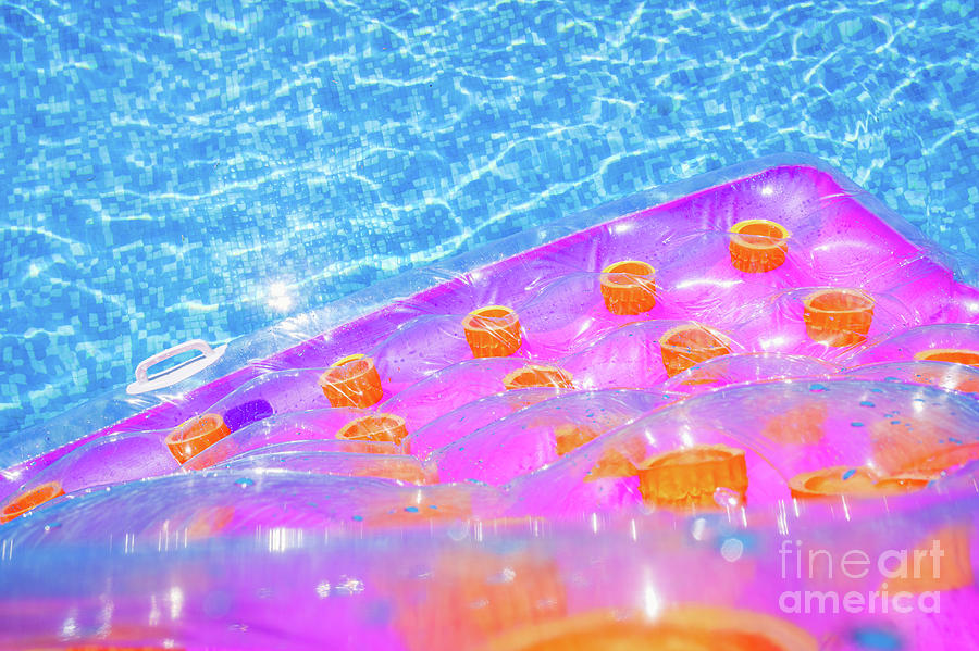 Inflatable floating mat in a pool in summer. Photograph by Joaquin Corbalan