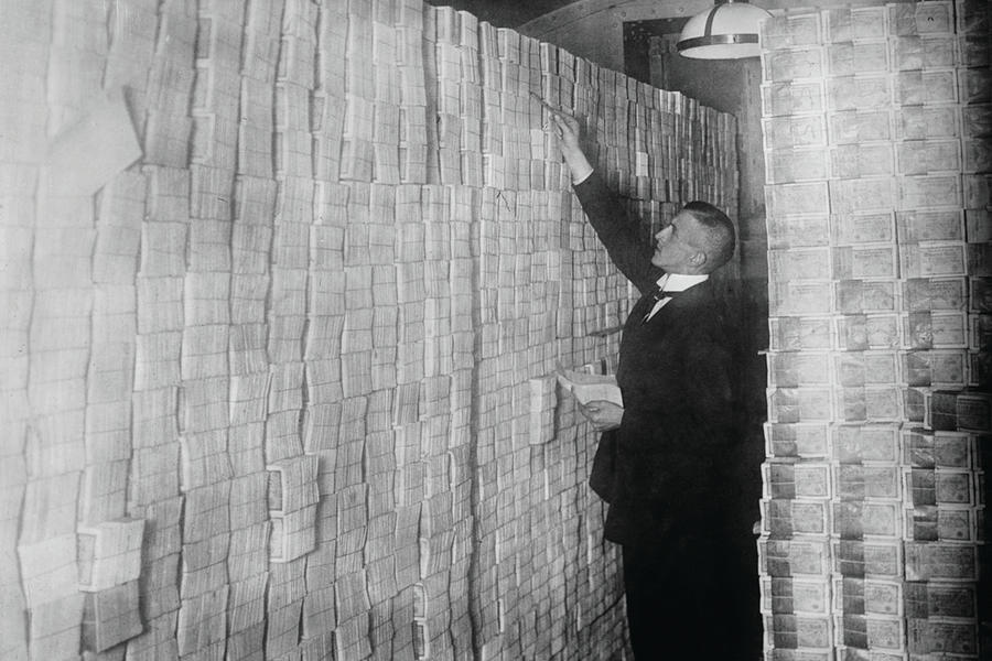 Inflation in Weimar Germany has paper money stacked from Floor to Ceiling in a Berlin Bank Painting by Unknown