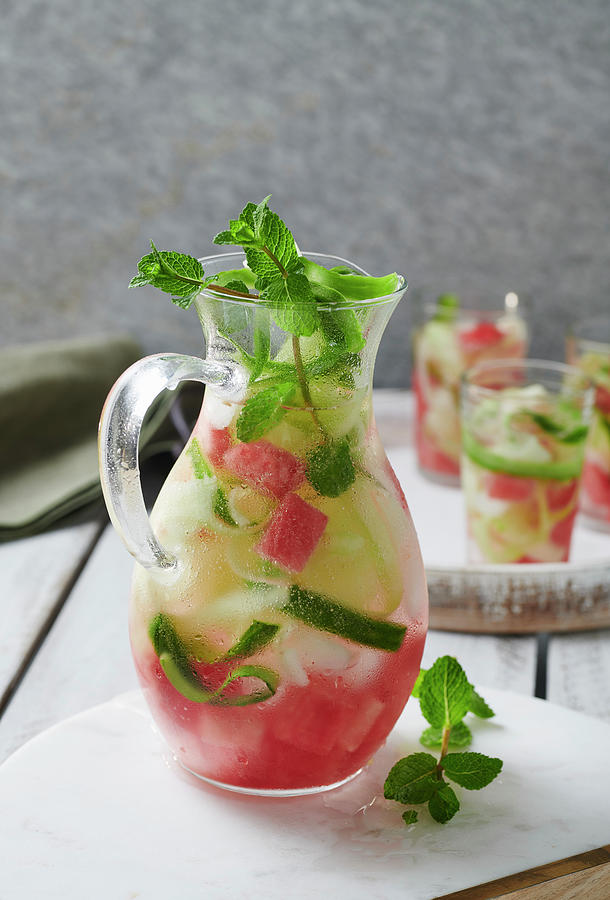 Infused Water With Cucumber And Melon Photograph by Stefan Schulte-ladbeck