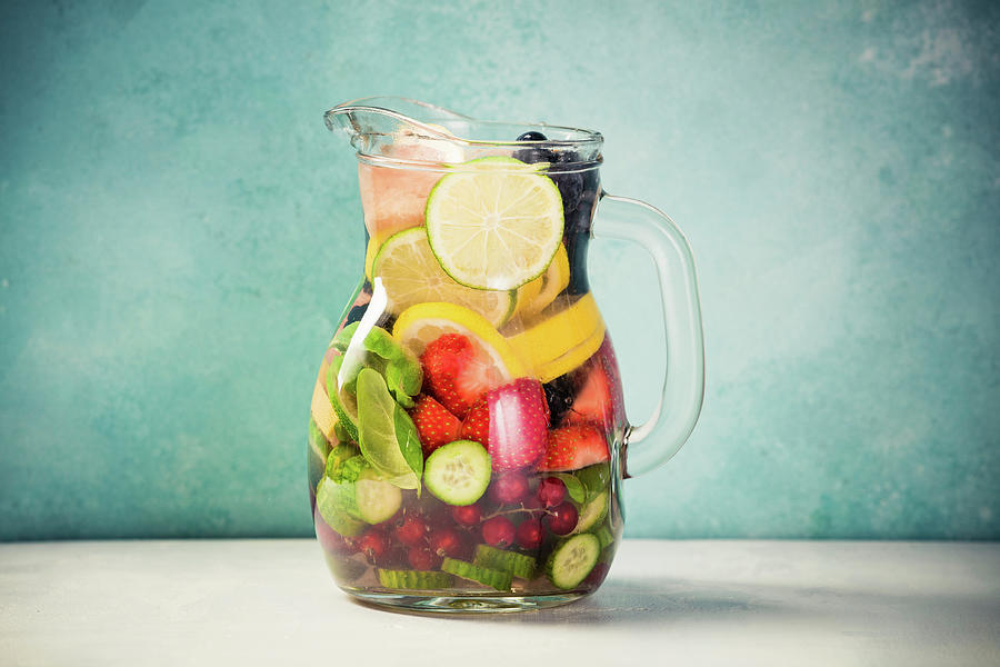 Infused Water With Fresh Organic Fruits And Berries Photograph by Natalia Klenova