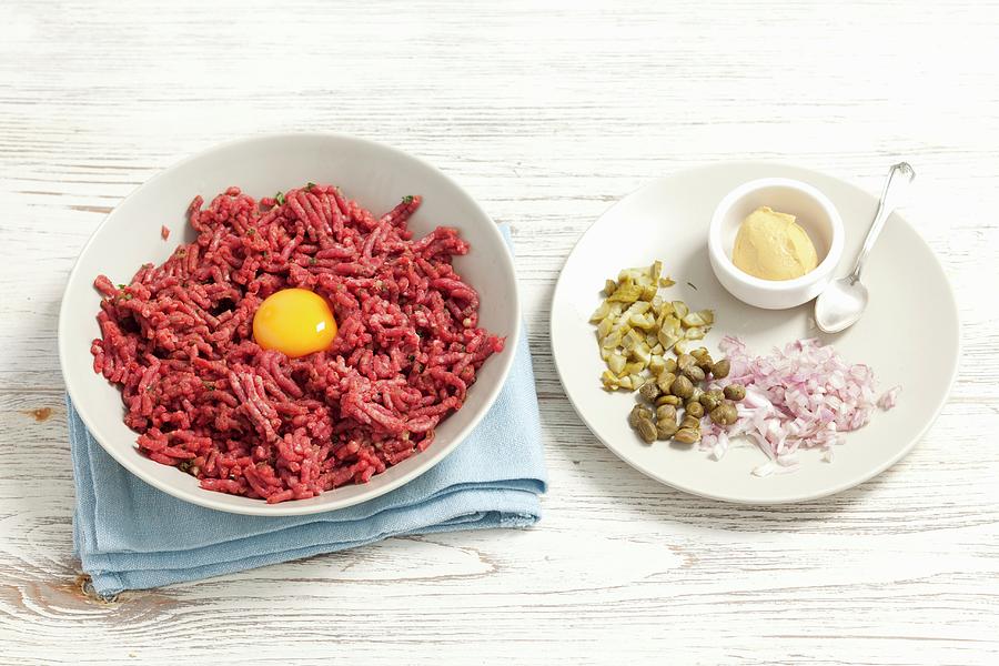 Ingredients For A Hamburger: Minced Meat With Egg Yolk, Onions, Cornichons, Capers And Mustard Photograph by Rua Castilho