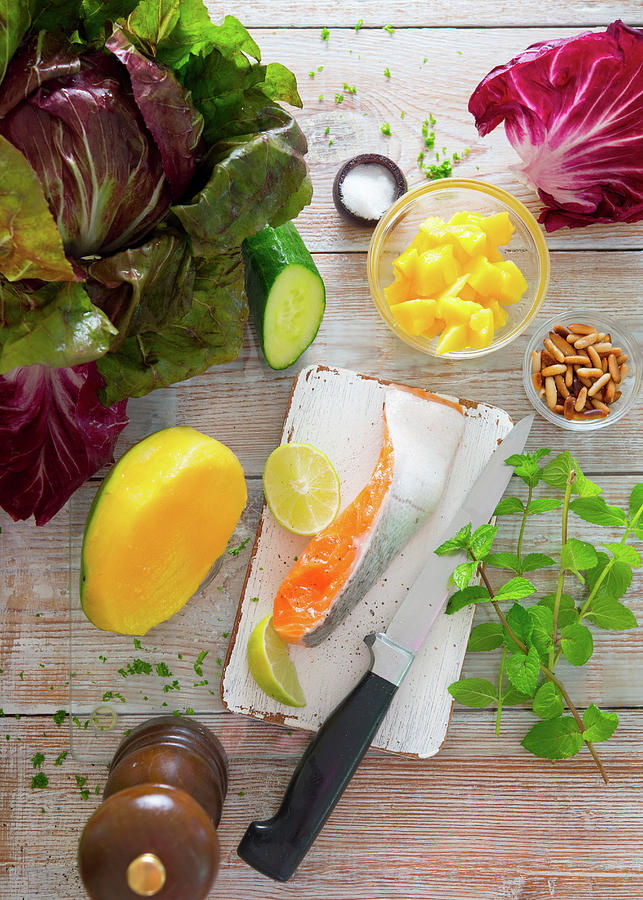 Ingredients For A Salmon Dish With A Mango And Cucumber Salad And Radicchio Photograph by Udo Einenkel