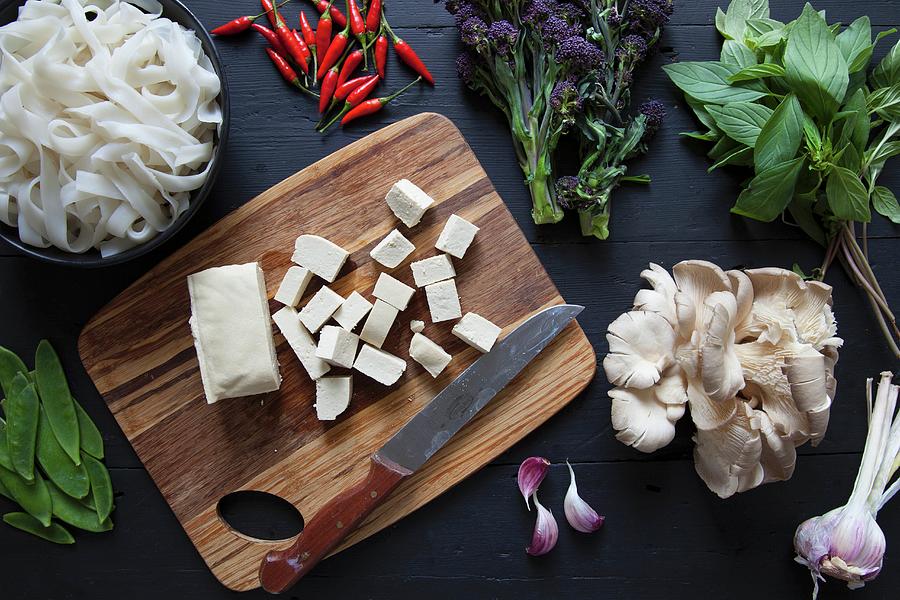 Ingredients For A Stir Fry: Tofu, Broccoli, Rice Noodles, Chilli, Thai Basil, Oyster Mushrooms, Garlic And Snow Peas Photograph by Andr Ainsworth