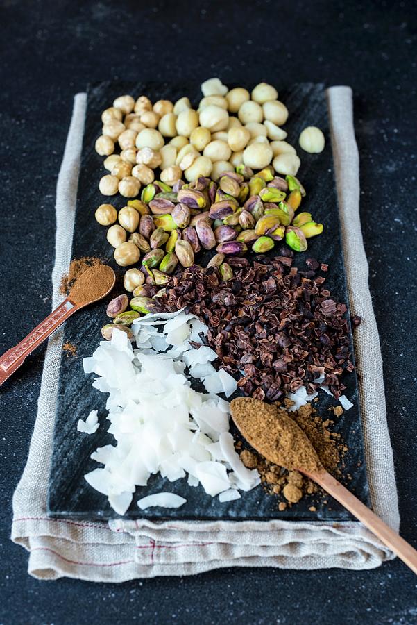 Ingredients For Dukkah a Nut And Spice Mix With Chocolate Photograph by Hein Van Tonder